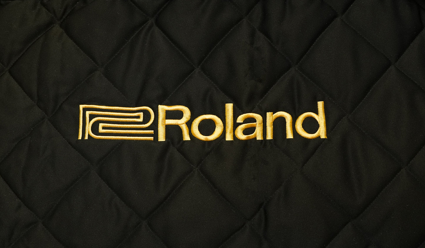 Roland piano cover with logo embroidery on black quilted mackintosh material.
